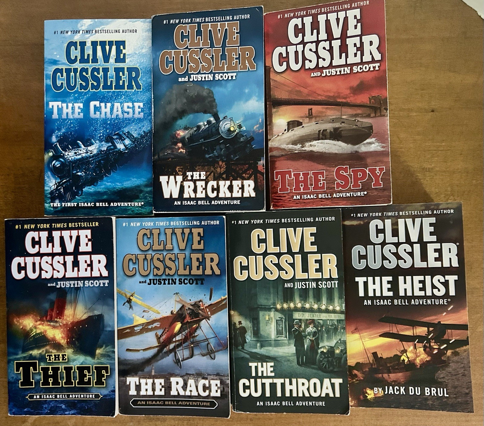 Clive Cussler Isaac Bell Adventure Series Lot of 7 PB books G to VG paperbacks
