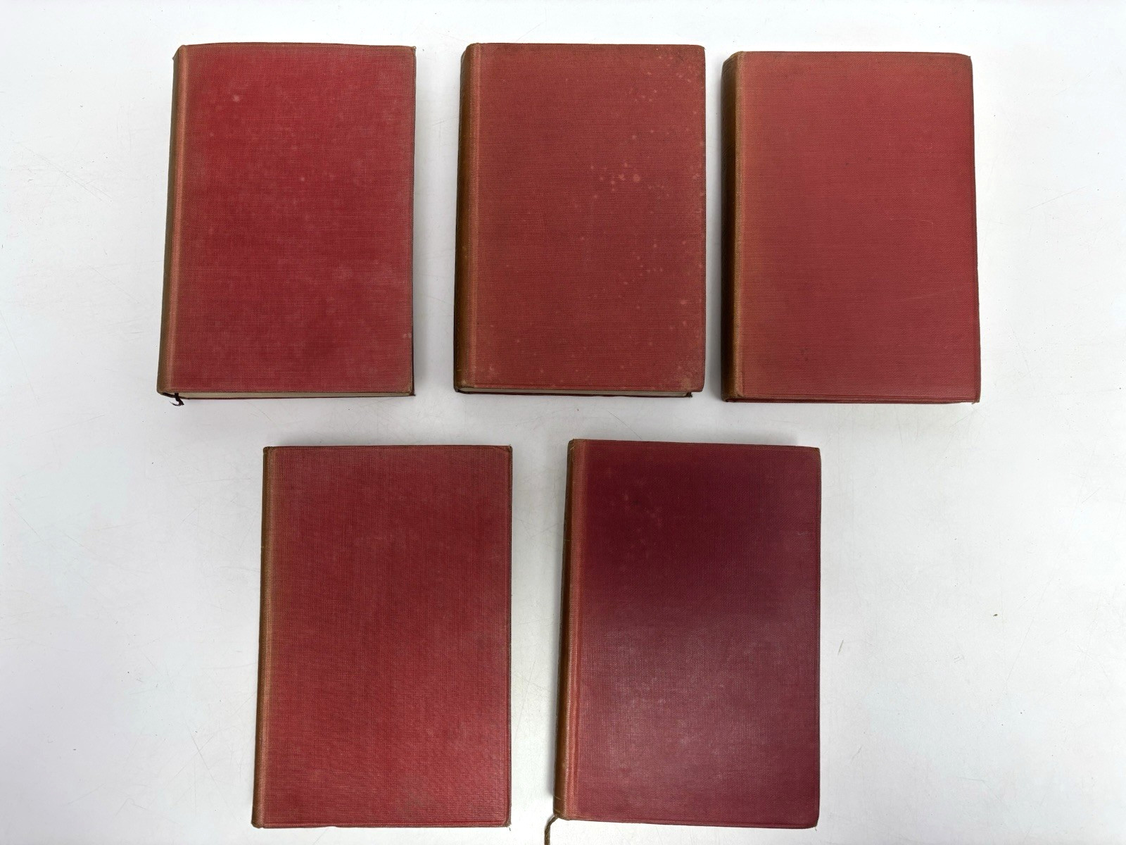 Collection of Small Old Books for Decoration. 12cm shelf space. 15.5cm Tall