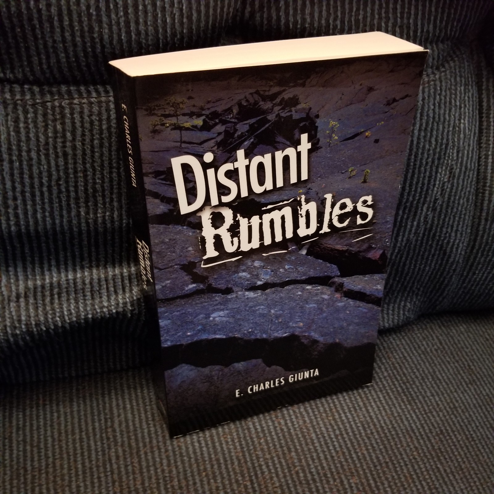NEW SIGNED: Distant Rumbles by E. Charles Giunta. Trade Paperback. 2011