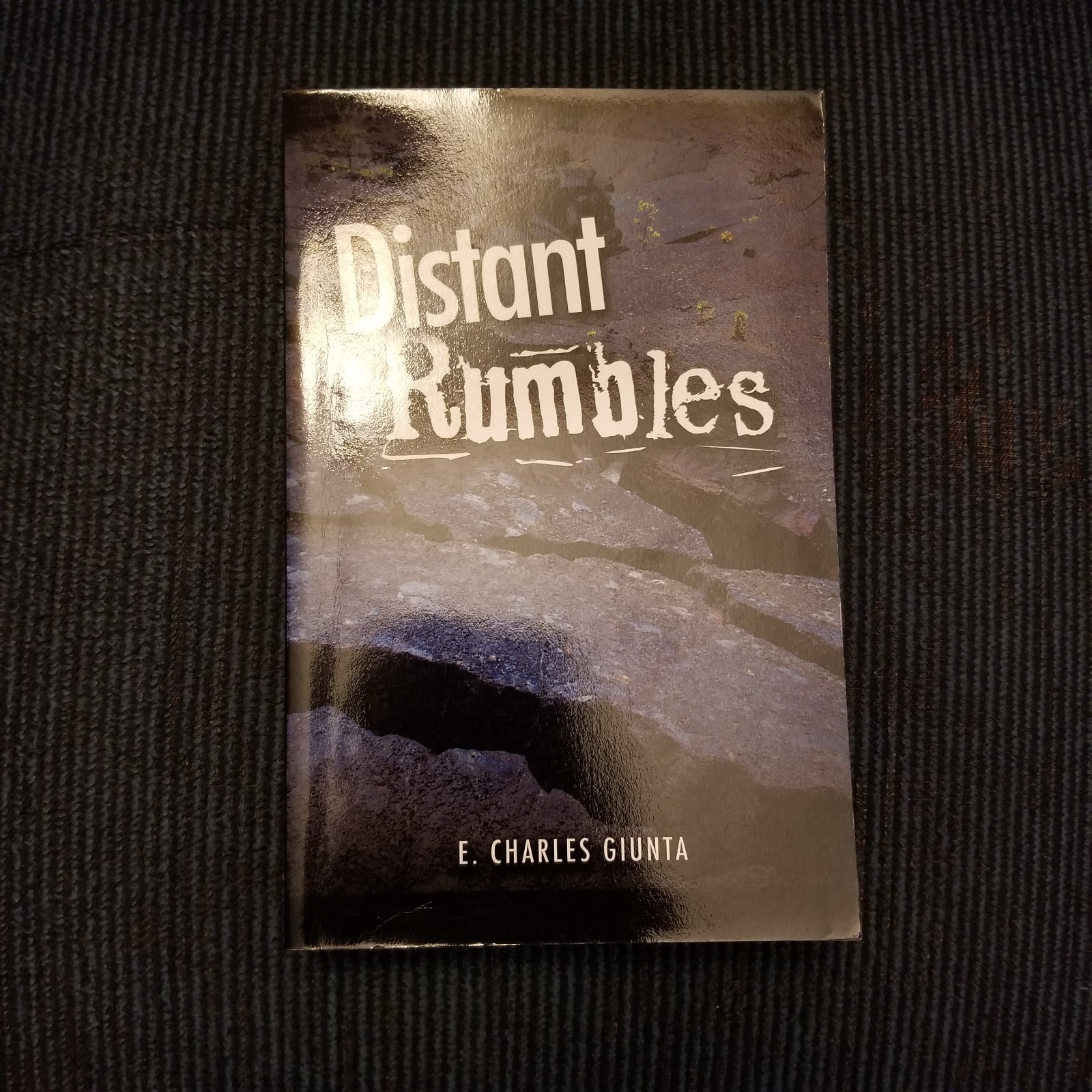 NEW SIGNED: Distant Rumbles by E. Charles Giunta. Trade Paperback. 2011