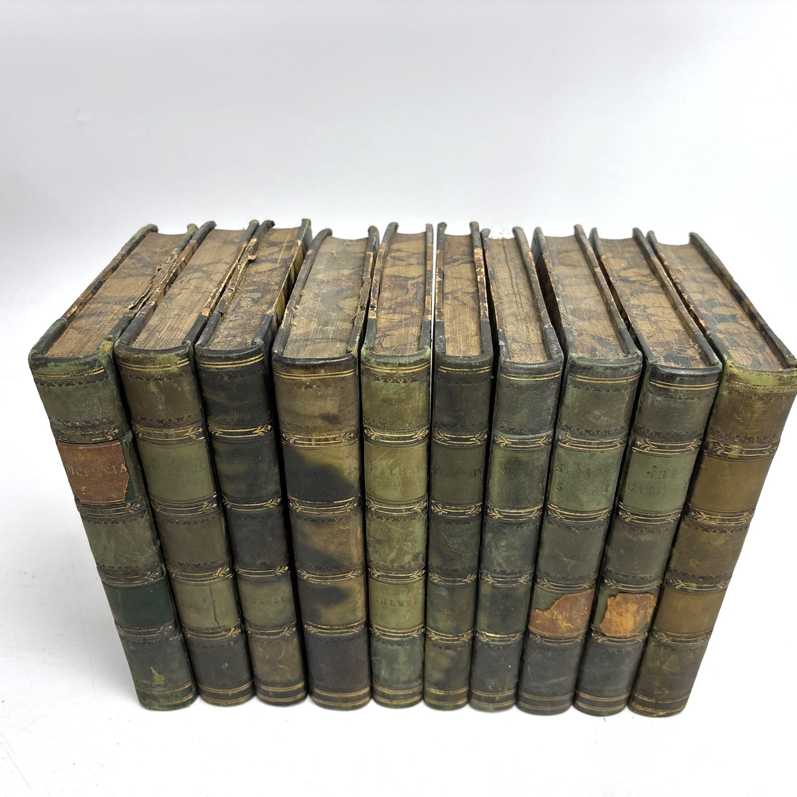 Distressed Old Books with Leather Spines for Decoration. 25.5cm shelf space.