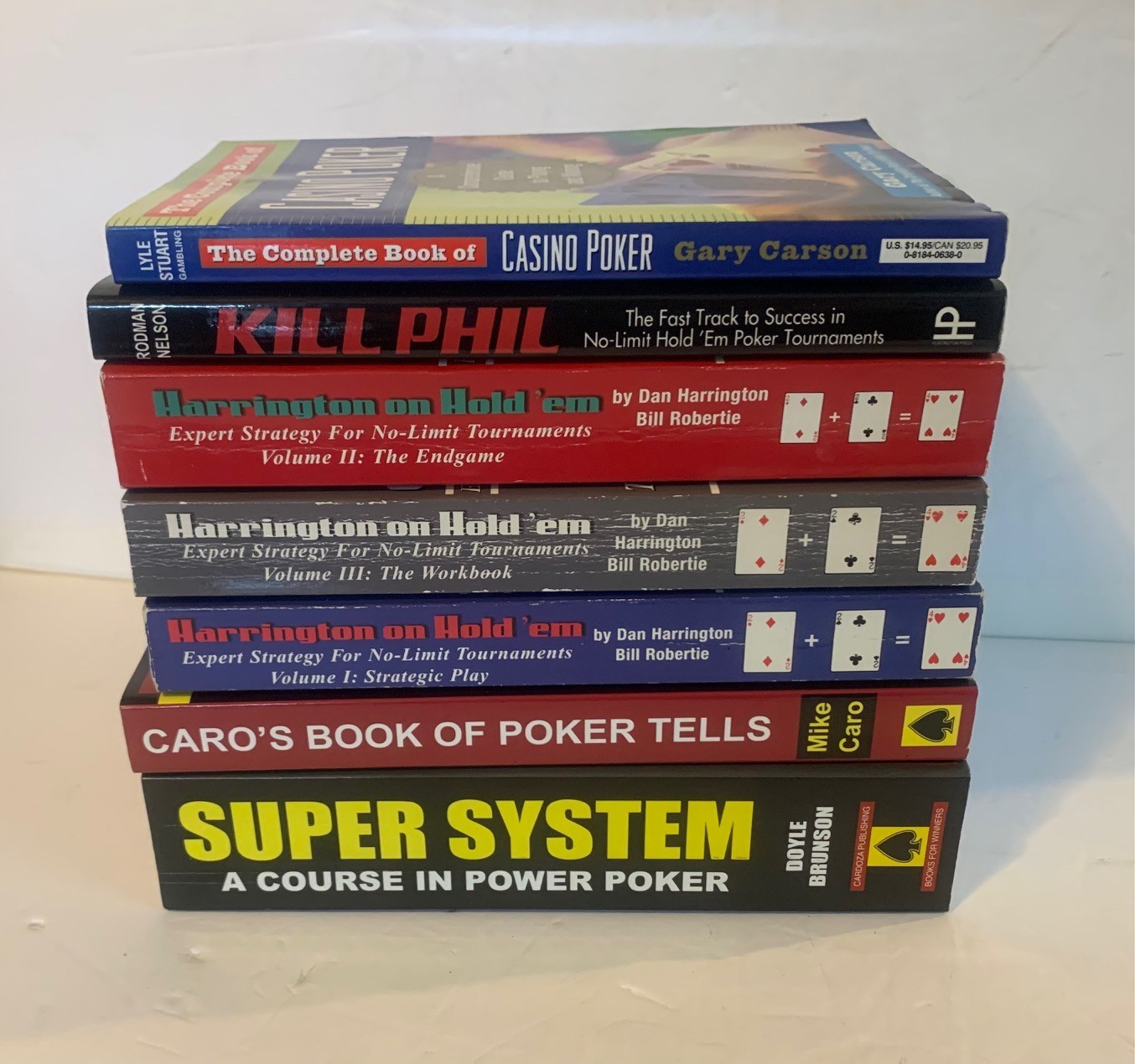 Lot of (7) Paperback Poker Books – Doyle Brunson, Dan Harrington, Mike Caro, Etc