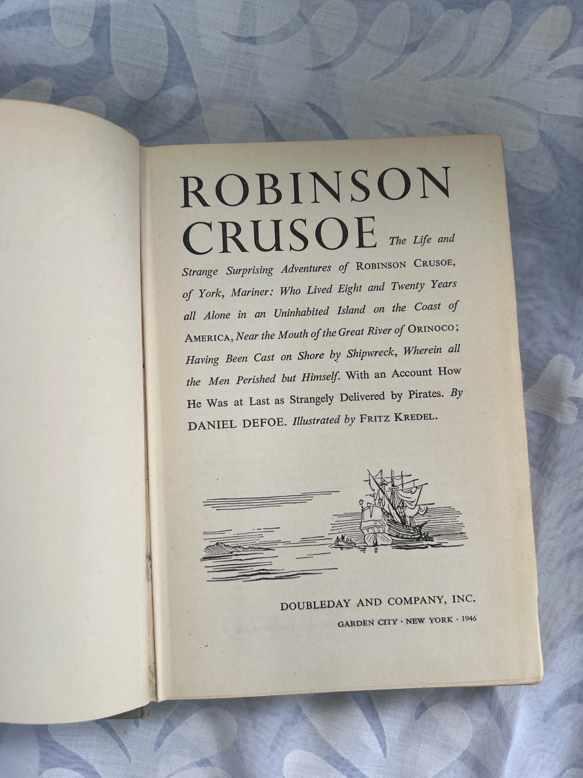 Robinson Crusoe by Daniel Defoe, published by Literary Guild