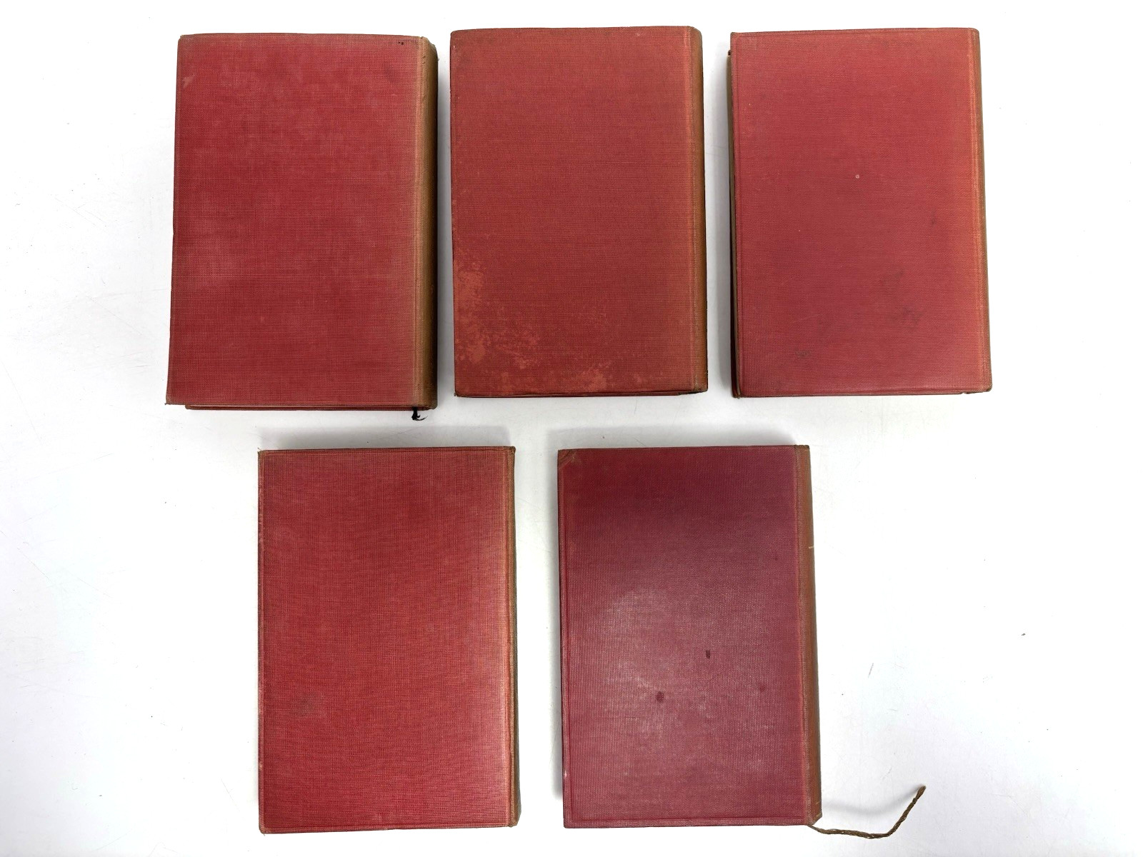 Collection of Small Old Books for Decoration. 12cm shelf space. 15.5cm Tall