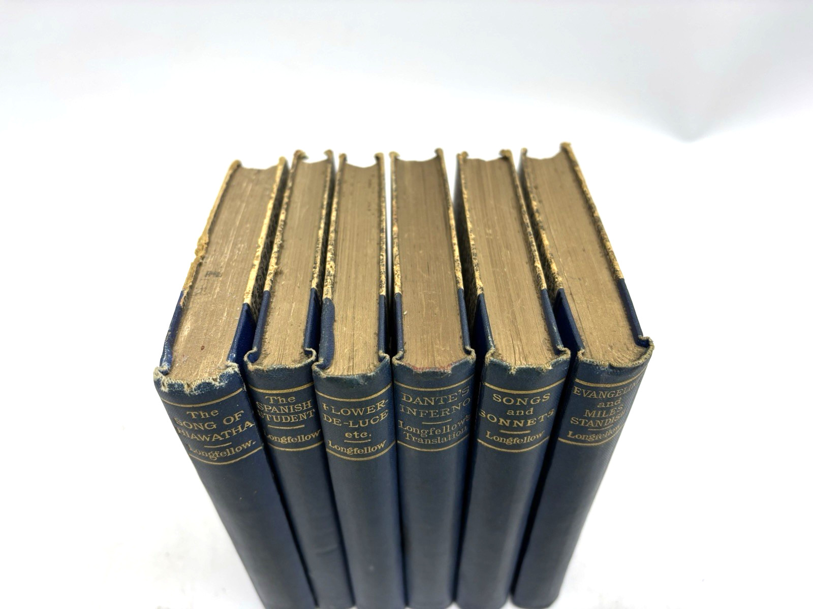 6 Small Decorative Old Blue Books. 11cm shelf space. 13.5cm Tall. Longfellow.
