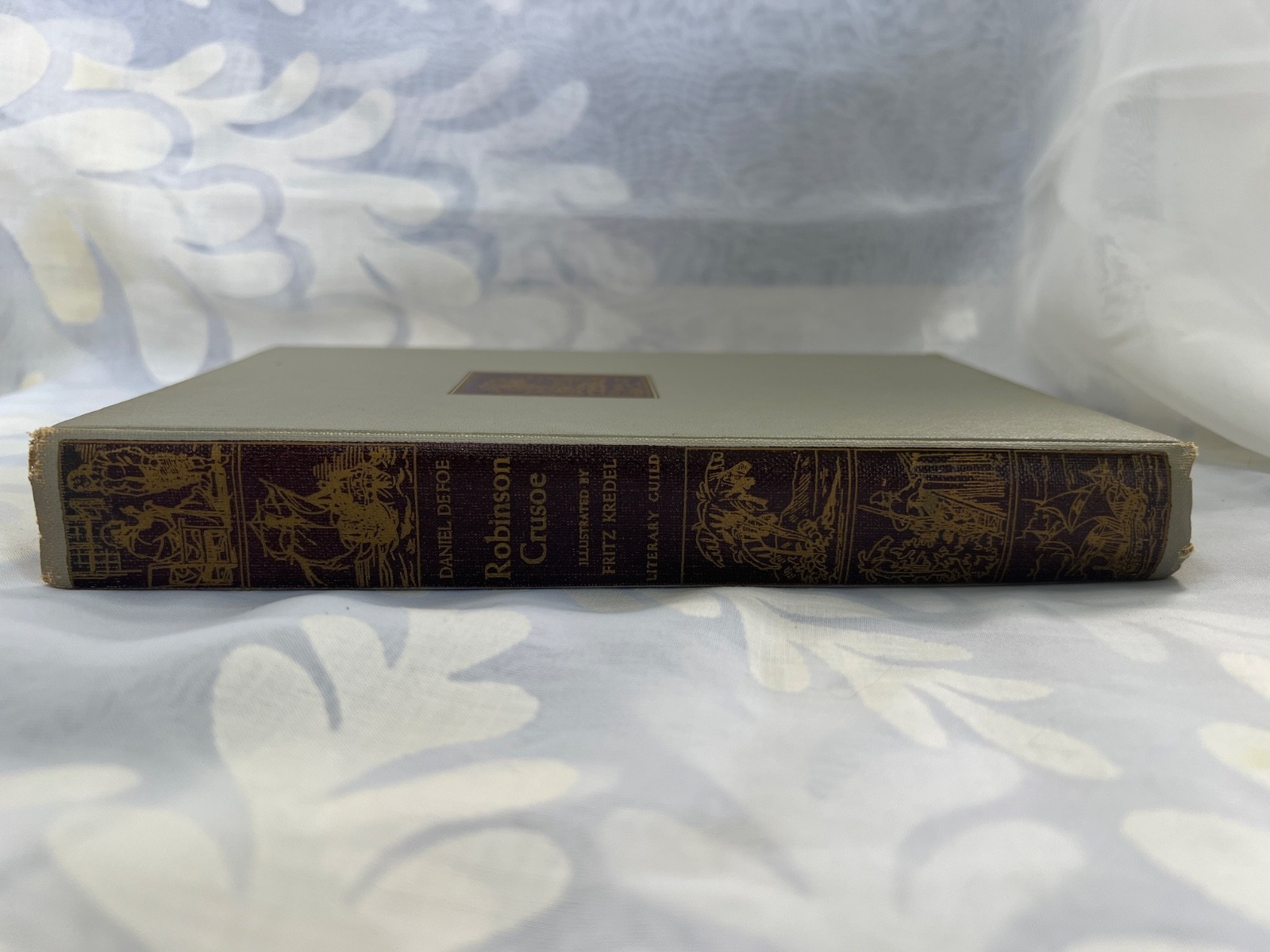 Robinson Crusoe by Daniel Defoe, published by Literary Guild