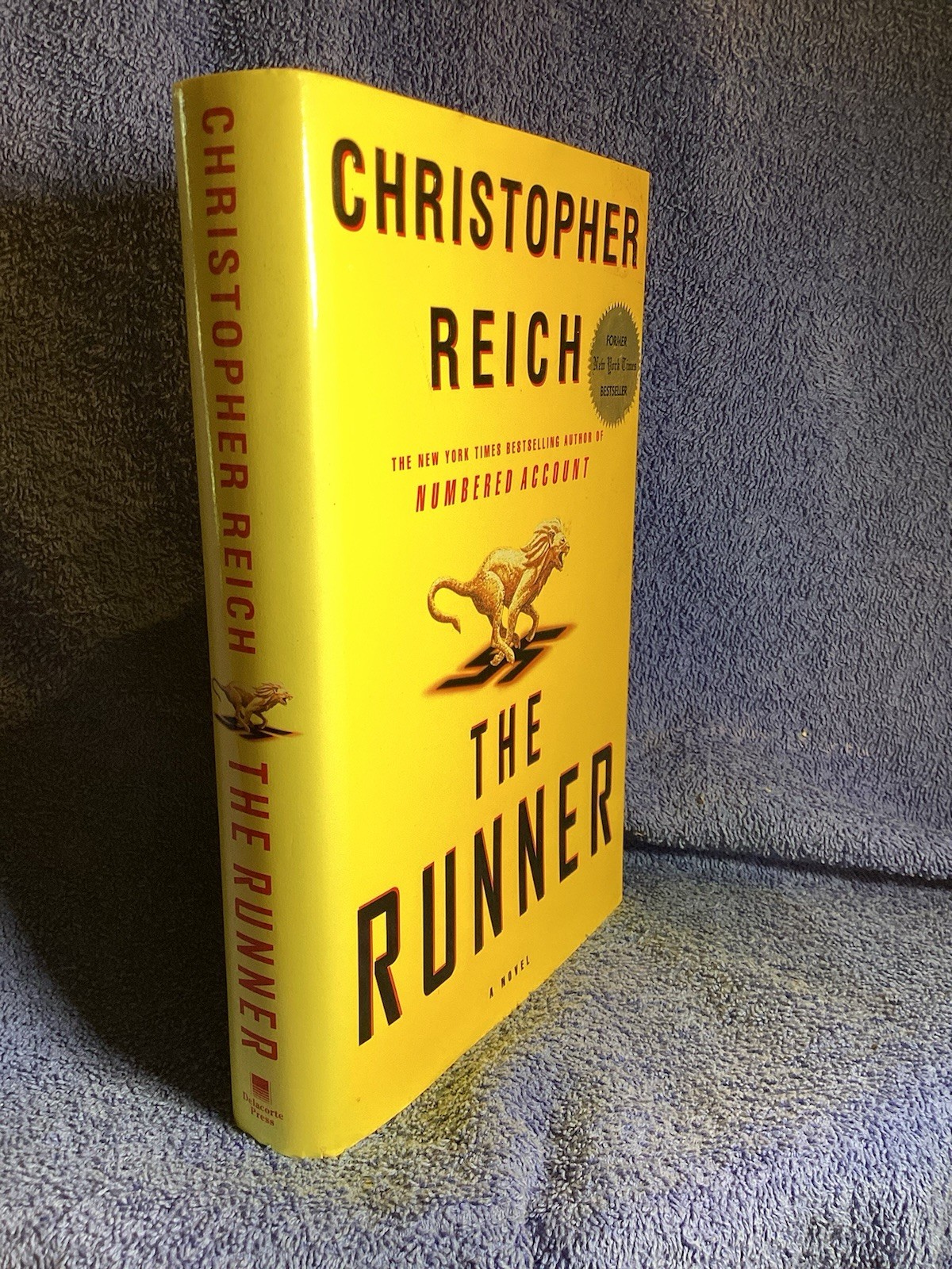 The Runner Christopher Reich Published By DeLacorte Press 2000. 440 Pages.
