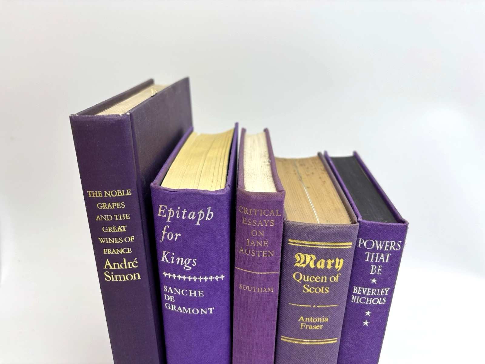 Collection of Purple Books for Decoration. 15.5cm shelf space.