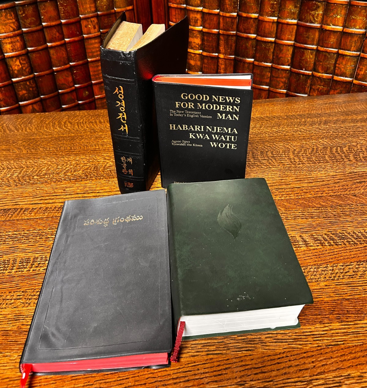 Holy Bible, lot of 4, in four different languages; Swahili, Plus
