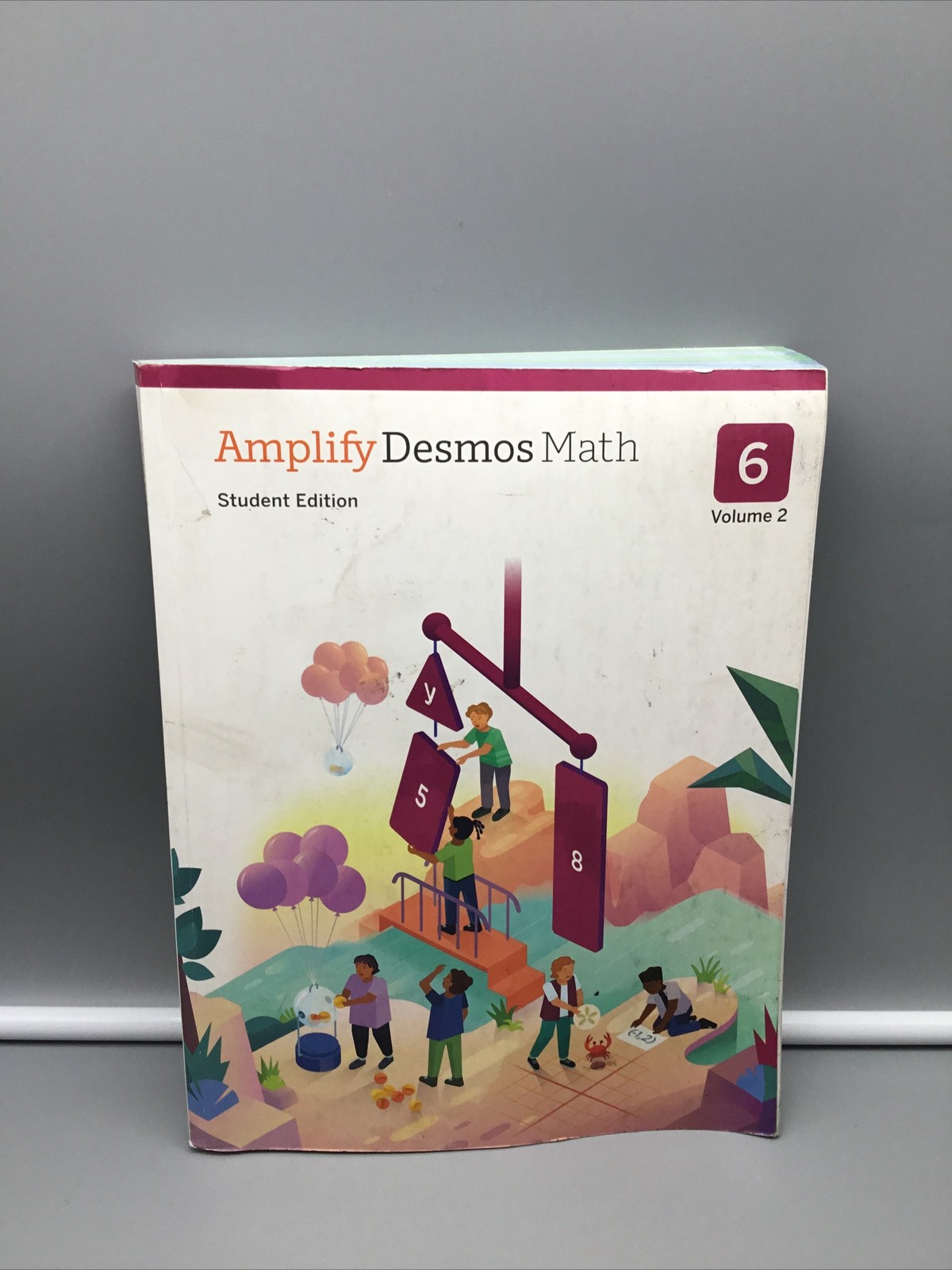 Amplify Desmos Math – Student Edition (6 Volume 2) Paperback – Acceptable